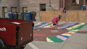 Liz Lambson working on the Black Lives Matter Mural at City Hall